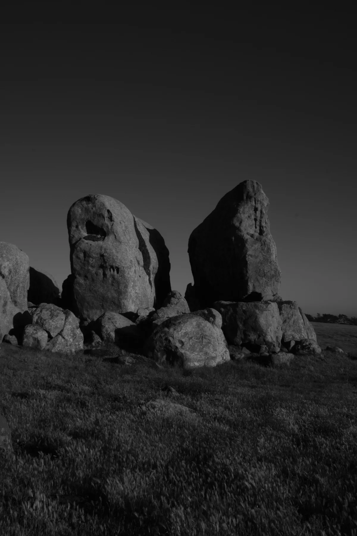 A lone climber silhouetted against a granite wall